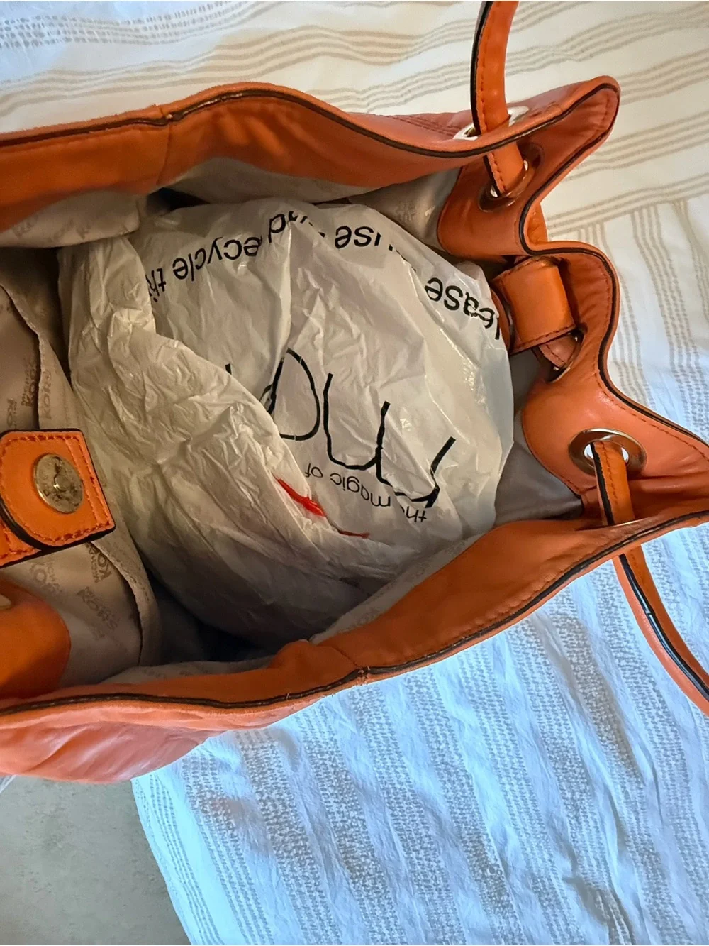 Michael Kors Orange Leather Hobo with Tassel Charm